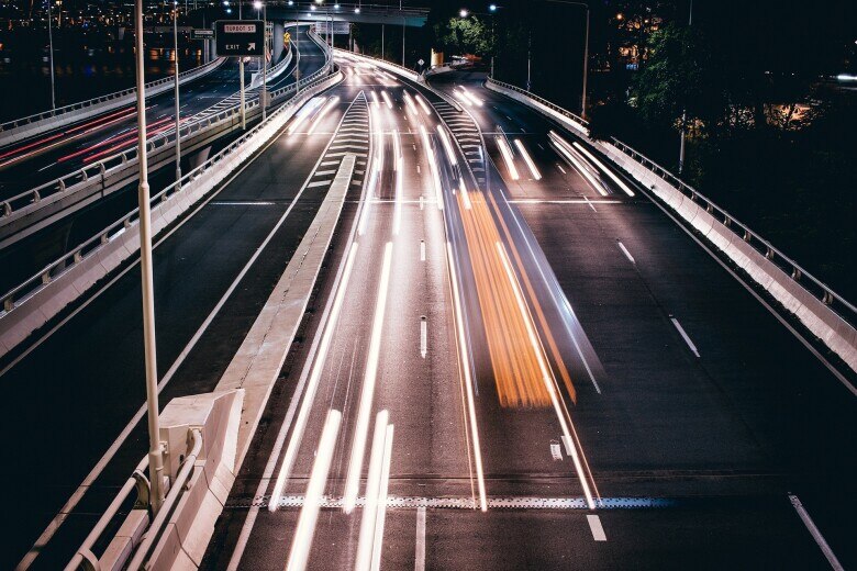 blurred lights of cars on a busy highway