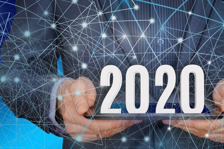 hands holding a 2020 sign