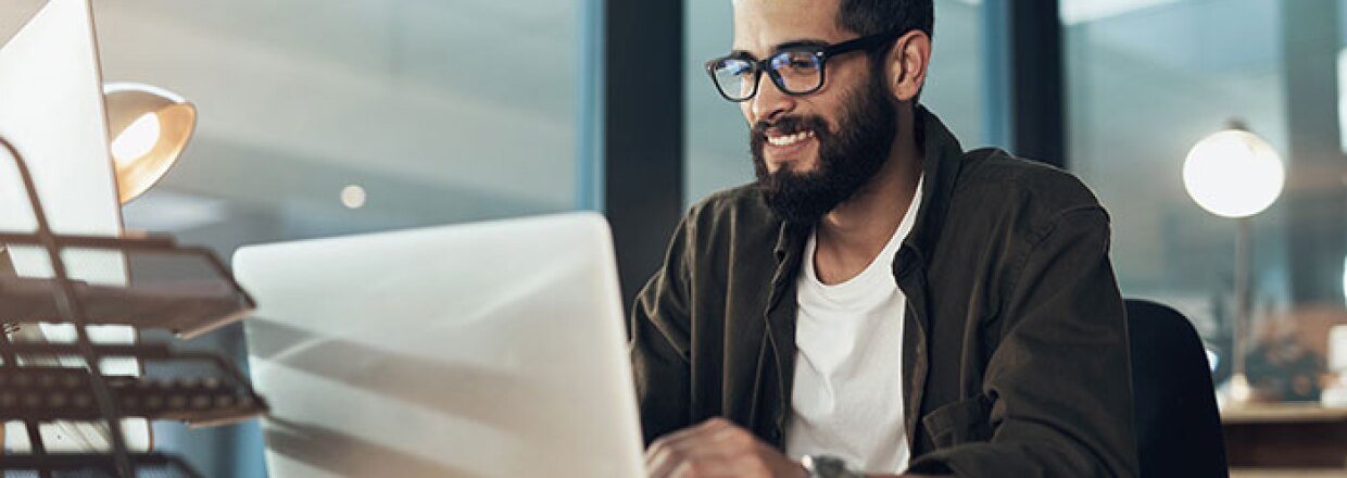 man working at laptop