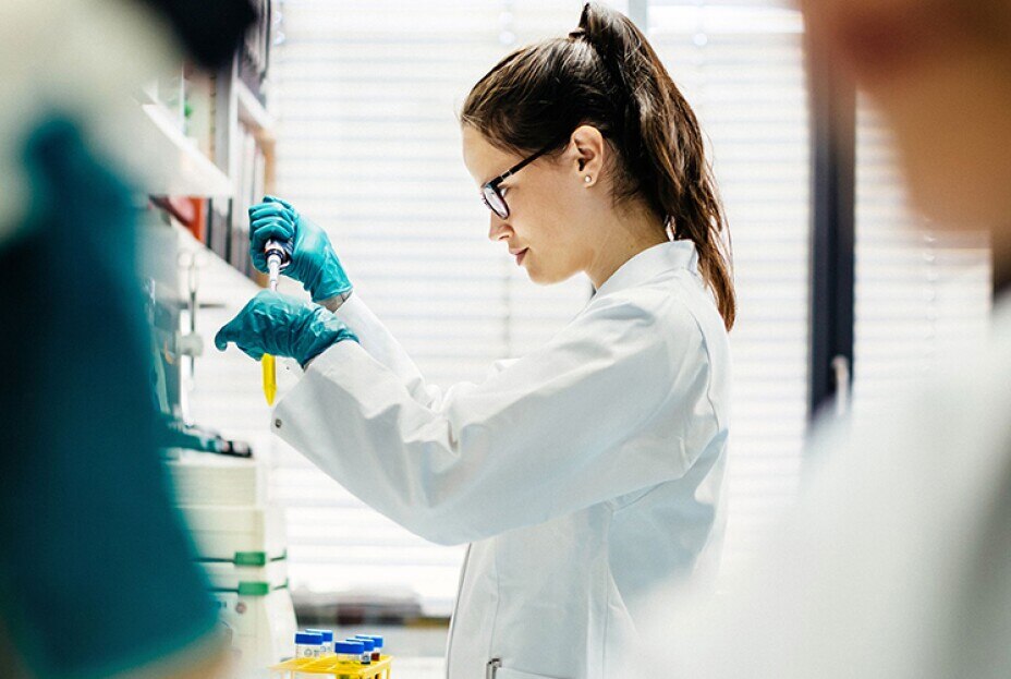 young scientist preparing a sample in a medical laboratory