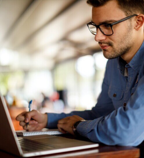 Young man working at a cafe