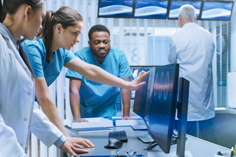 group of doctors looking at images