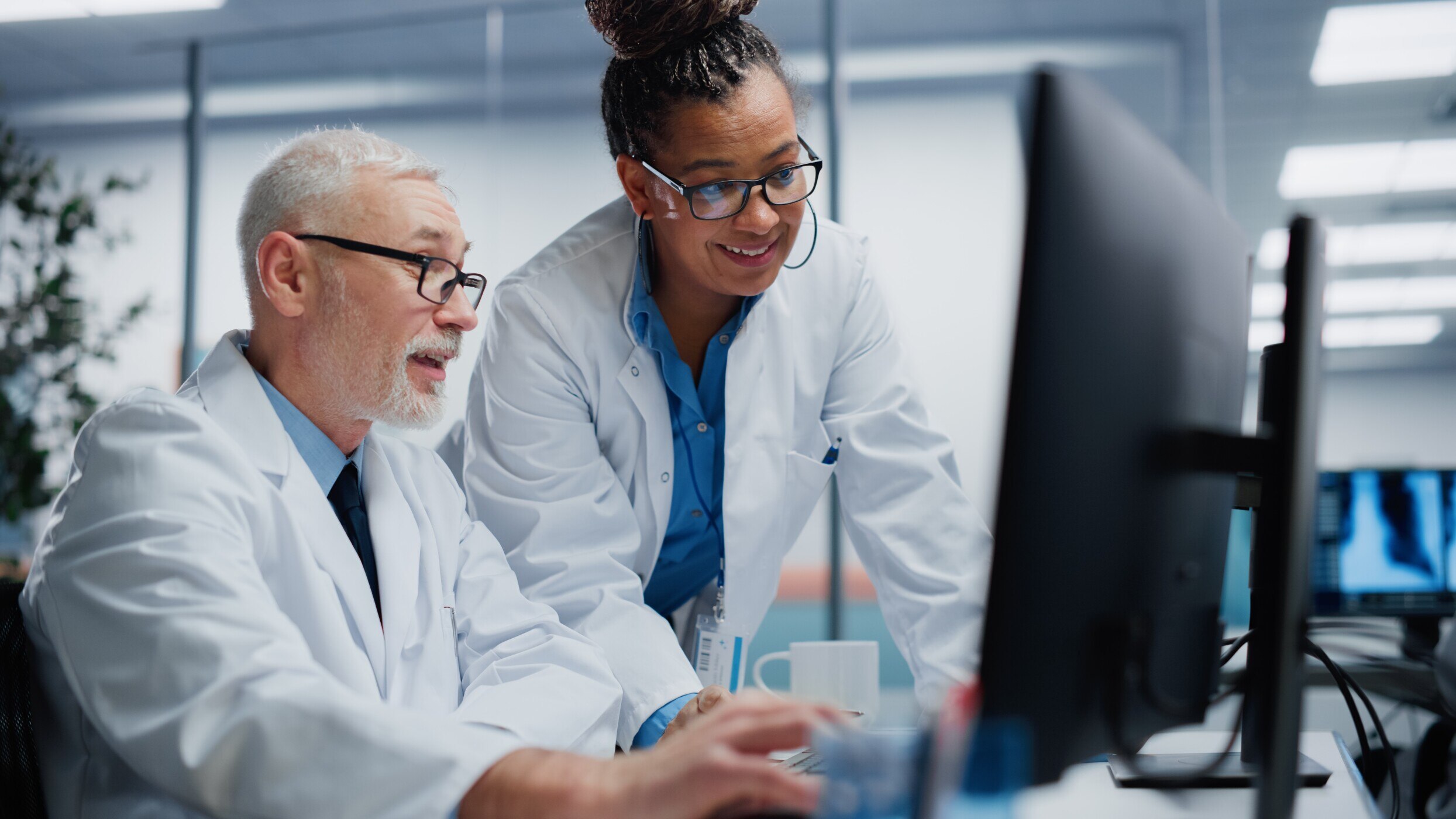 doctors looking at monitor