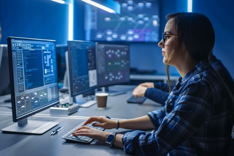 team of computer programmers working in a shared space