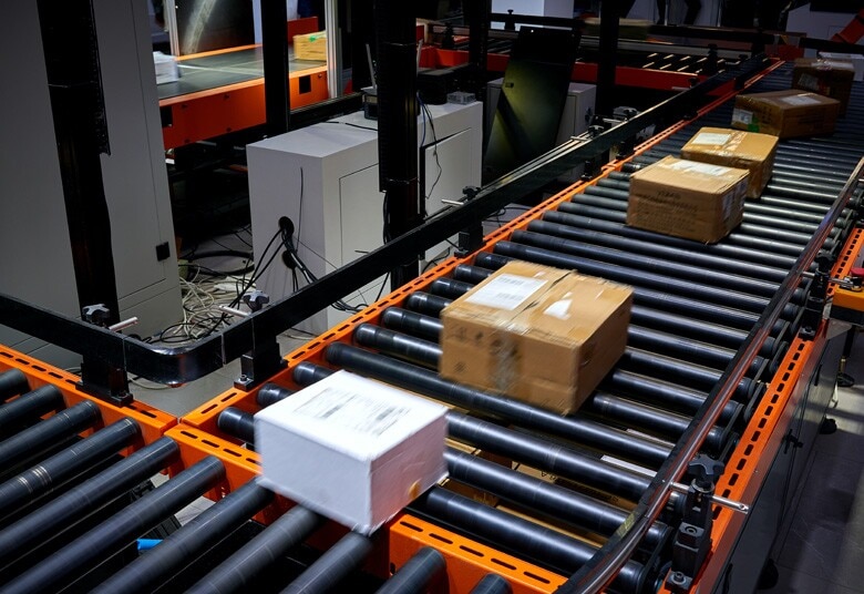 boxes rolling on a conveyor belt in a warehouse