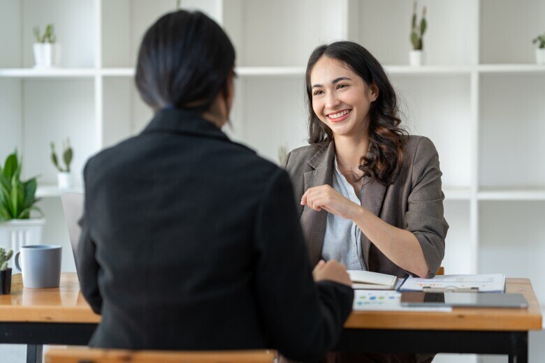 2 business people in a meeting