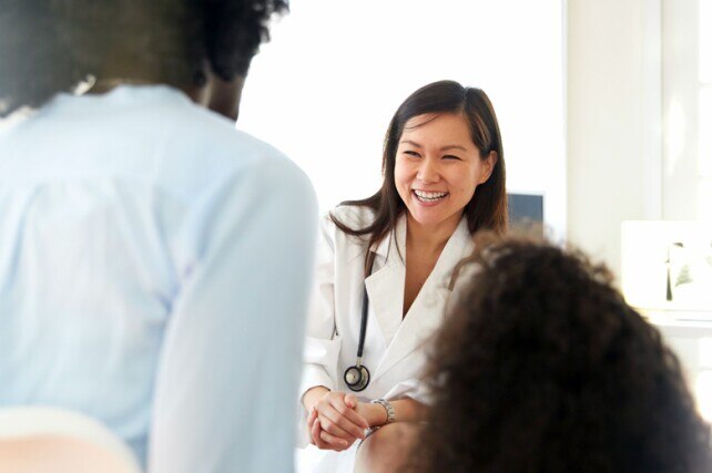 Female doctor speaking with patient