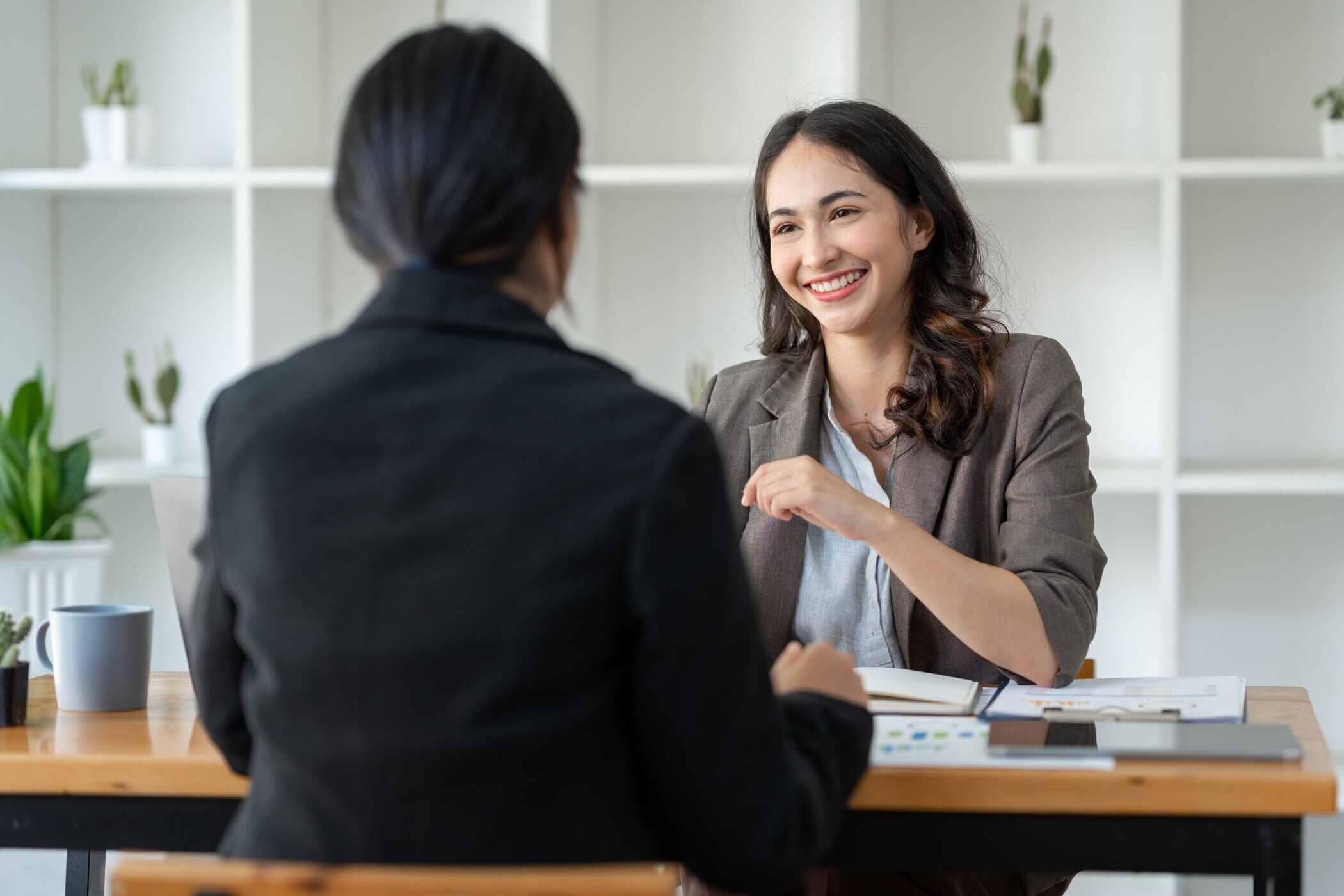 2 business people in a meeting