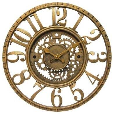 gold wall clock reading 10 minutes after 10 o'clock