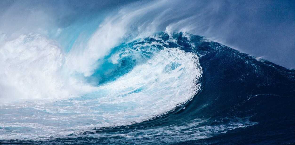 large wave crashes in the ocean