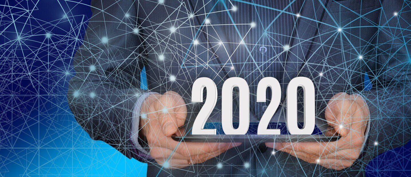 hands holding a 2020 sign under a transparent layer of connected data points