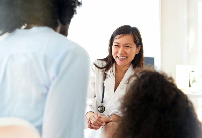 Female doctor speaking with patient
