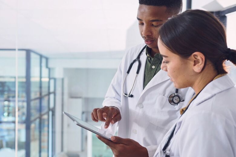 Doctors looking at an ipad