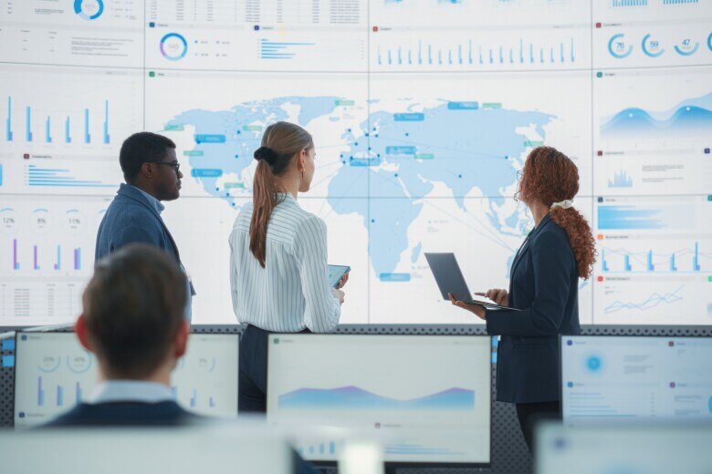 meeting in front of video wall