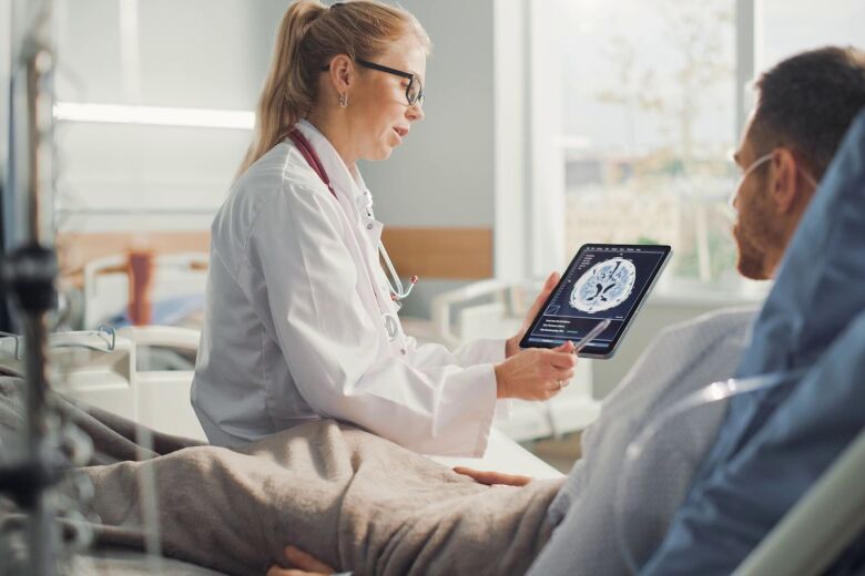 Bedside Doctor and Patient with ipad