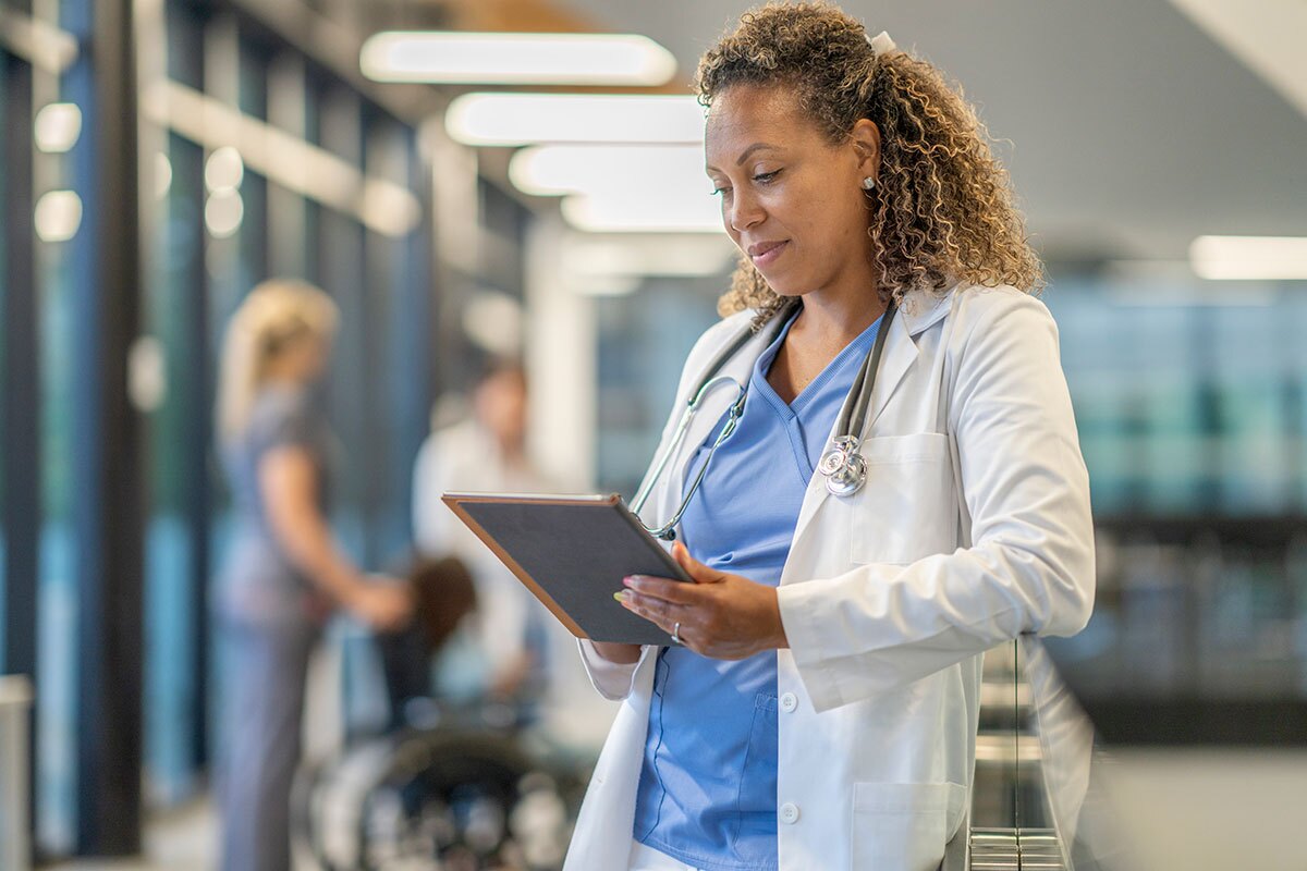 female doctor looking at a tablet in the ER
