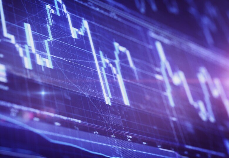 glowing line graphs on a bright screen