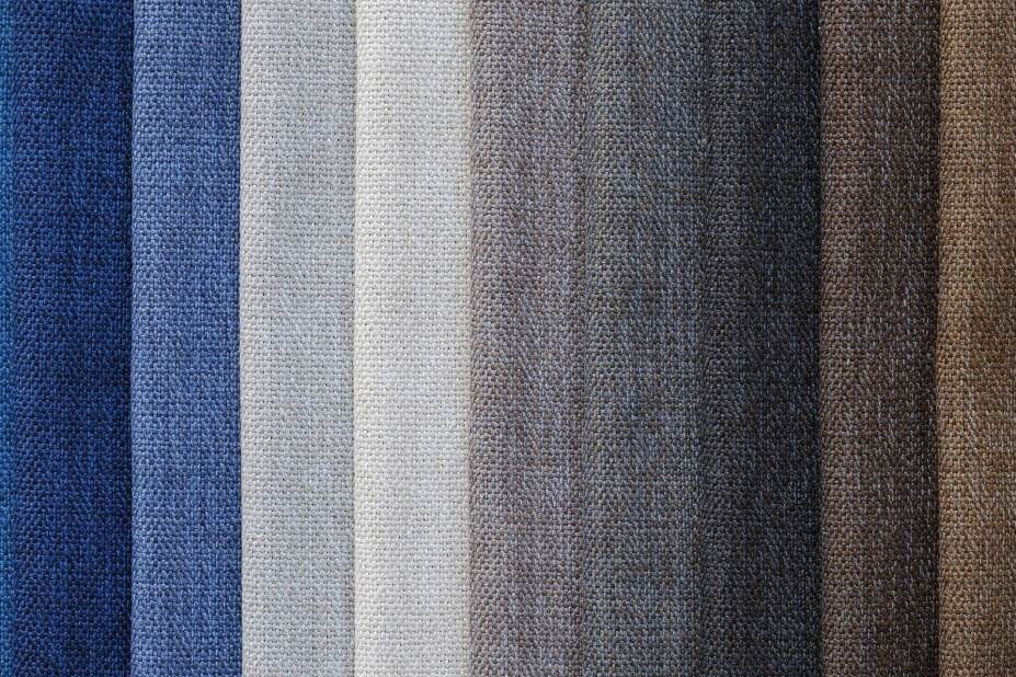 folds of fabric in varying shades of blues, neutrals and browns