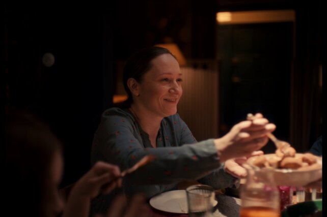 Mother at dinner table