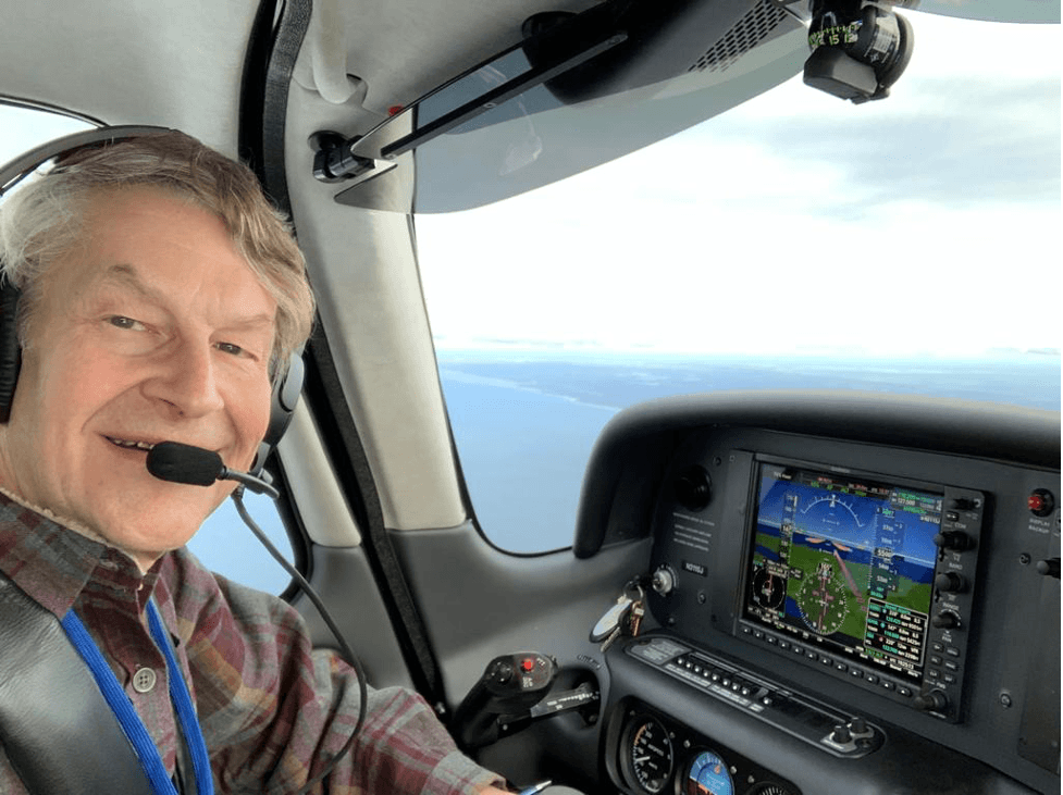 Dr. Liberman in cockpit of an airplane