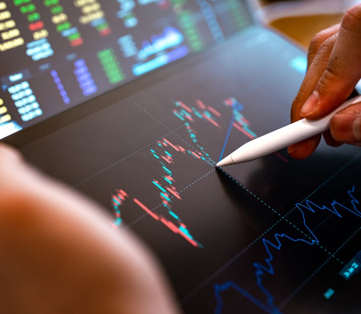 financial graphs on tablet