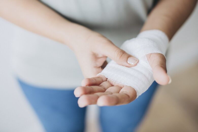 injured hand wrapped in gauze