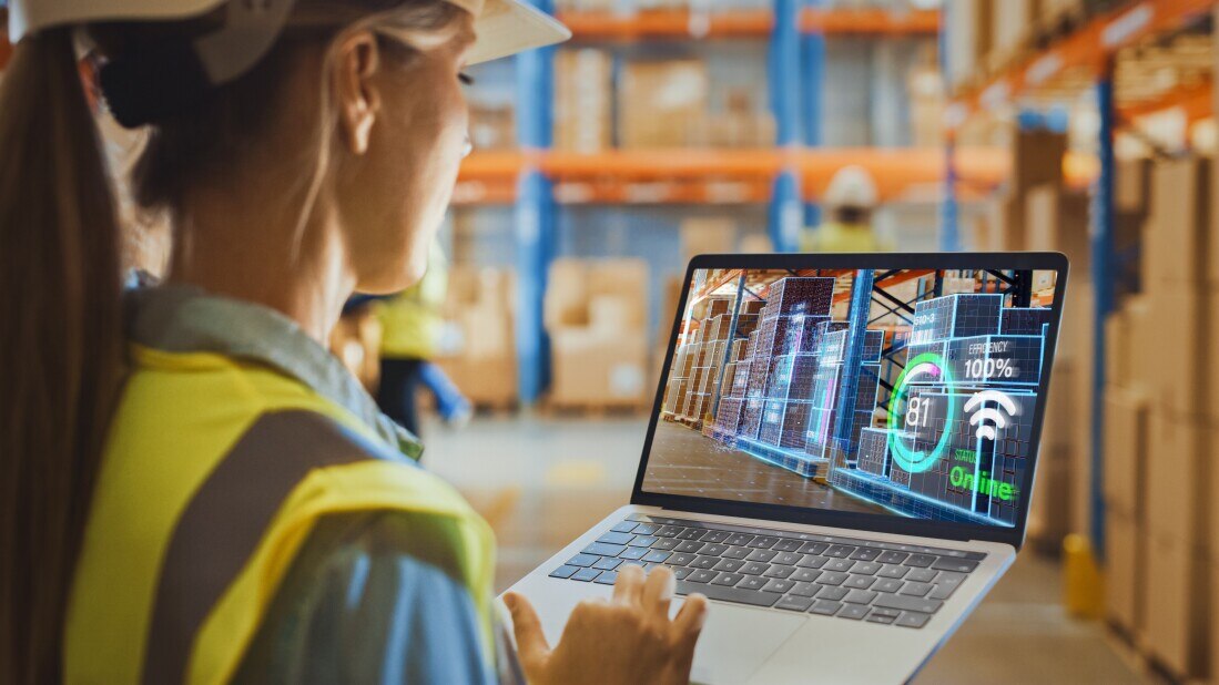 Futuristic Technology Warehouse: Female Worker Doing Inventory, Using Augmented Reality Program On Laptop Computer