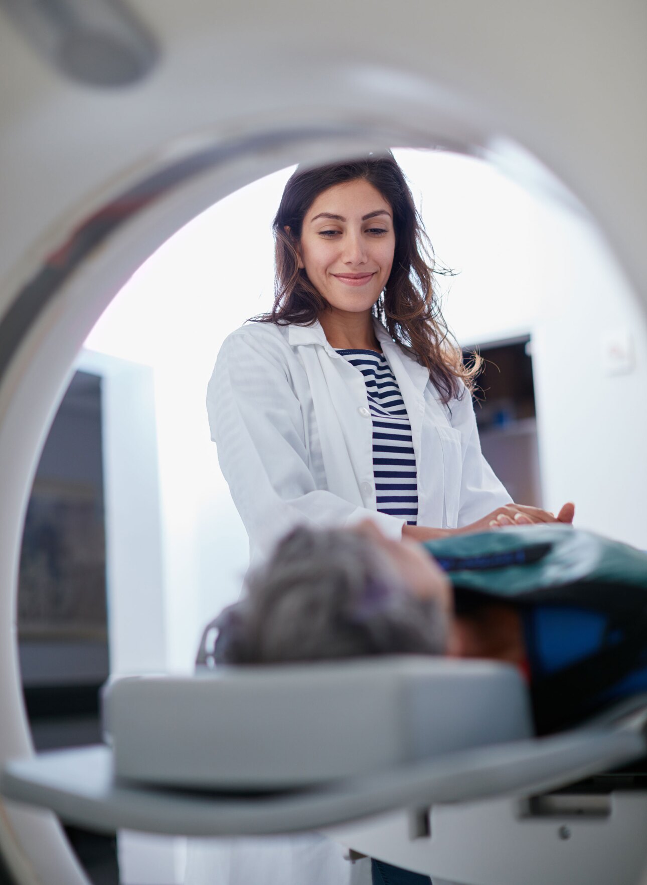lab tech preparing patient for medical imaging