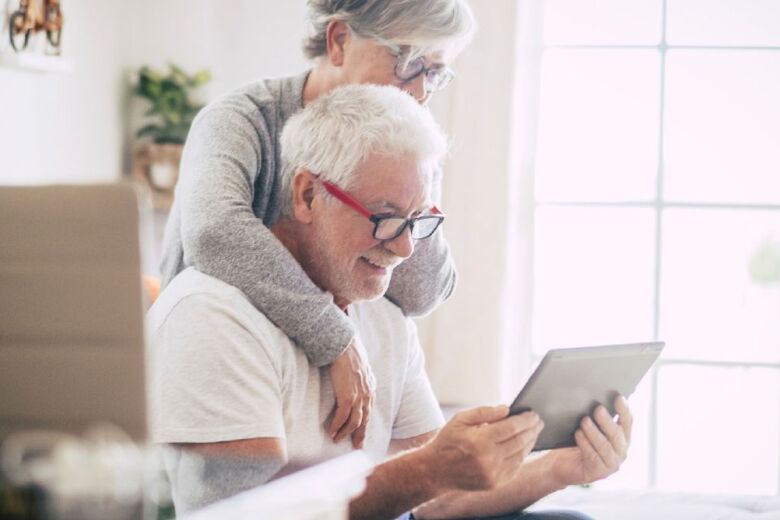 older couple looking at ipad