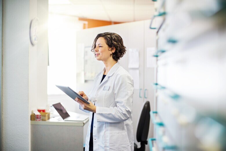Female pharmacist with a digital tablet