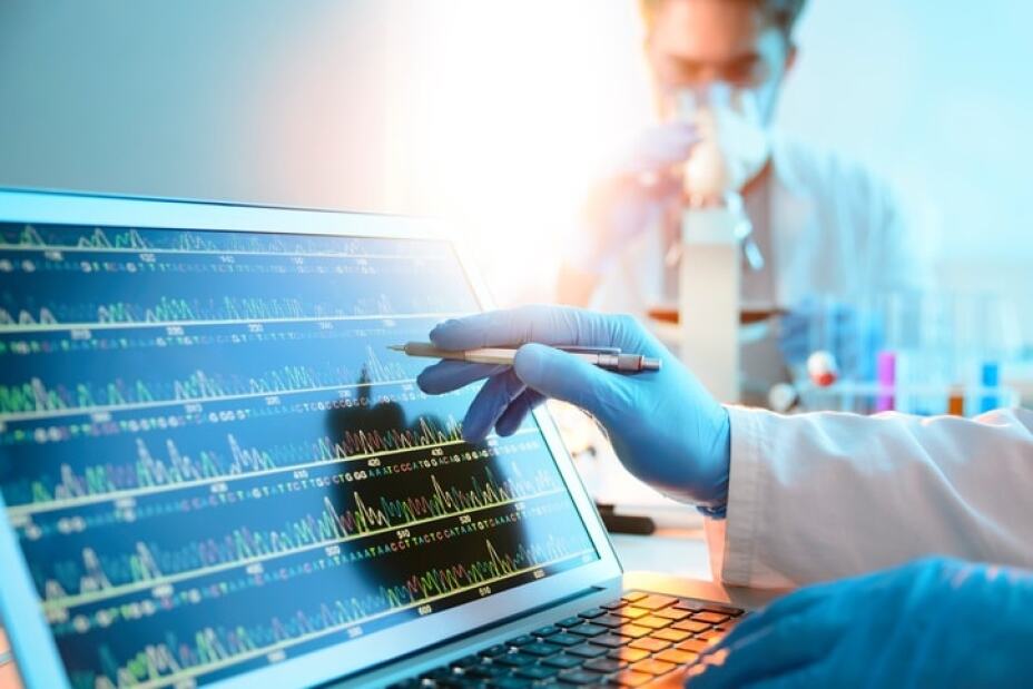 scientists in a clinical laboratory analyzing a DNA sequence