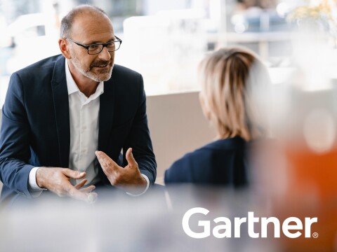 Gartner business analysts having a discussion