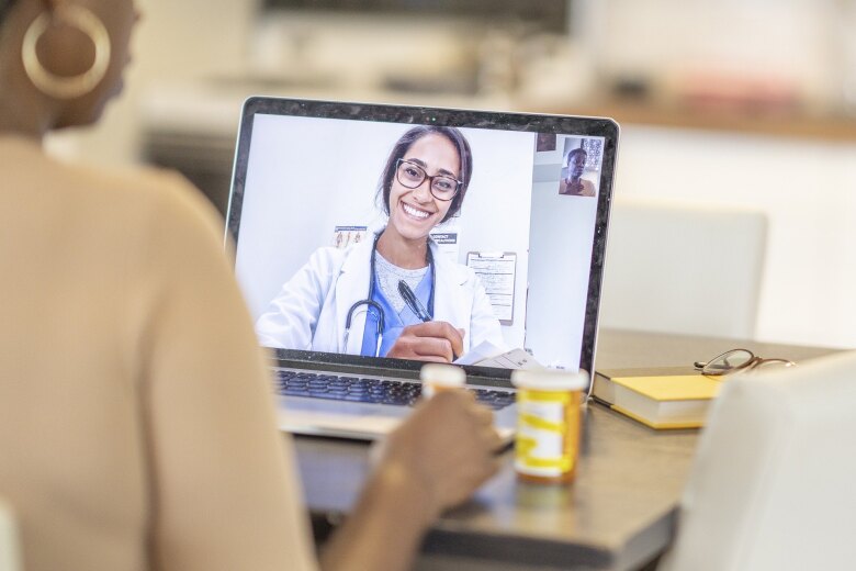 patient discussing medication. with doctor on video call