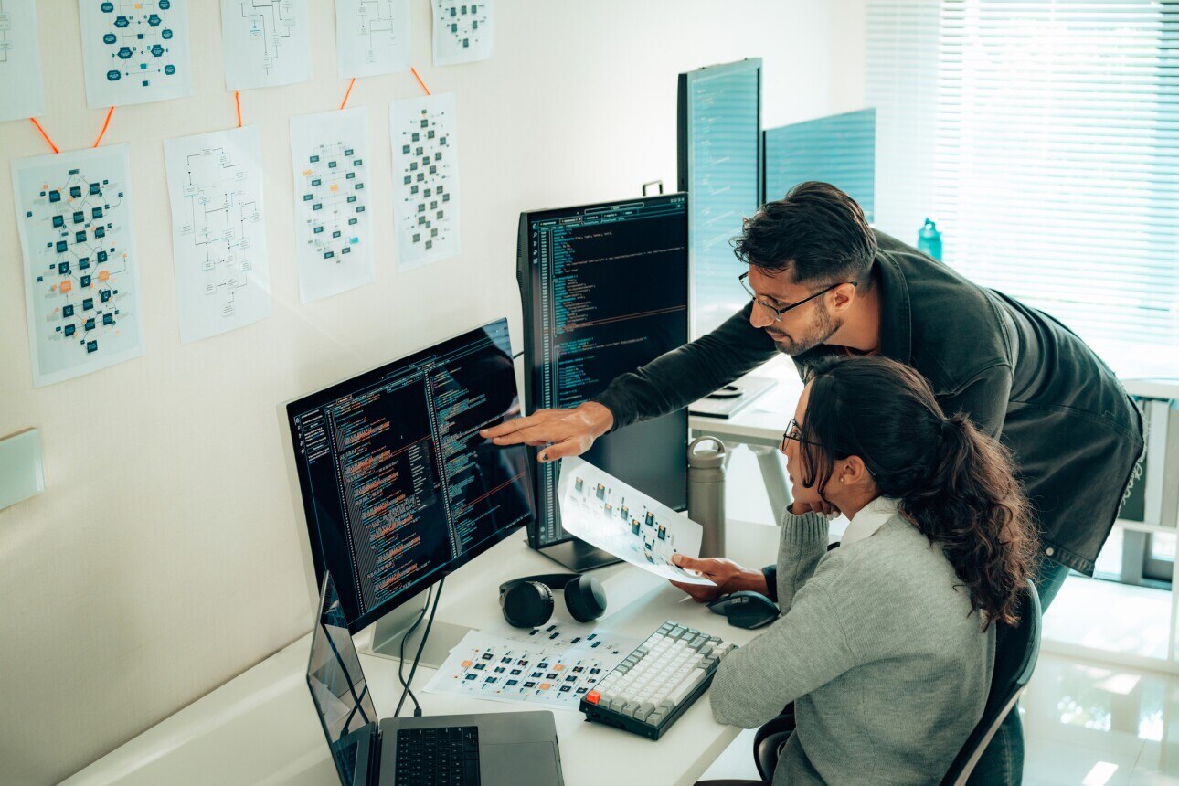Hispanic Programmers Collaborating on Software Development in a Modern Office Setting