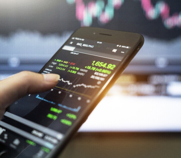 smartphone with financial charts