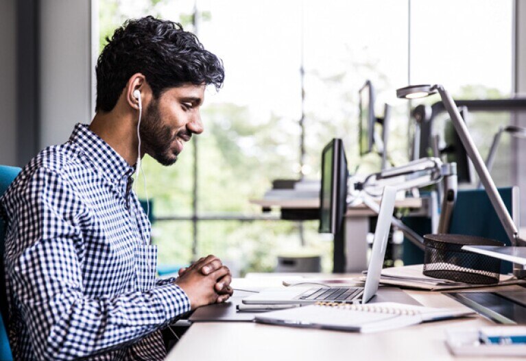 student looking at laptop