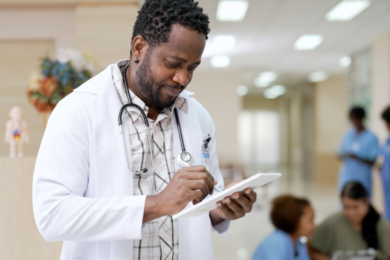 doctor with tablet