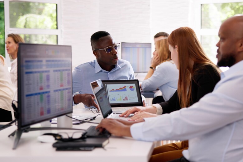 Analyst Working With Spreadsheet Business Data On Computer