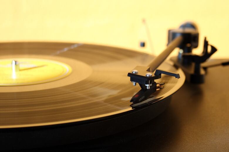 vinyl album spins on a record player