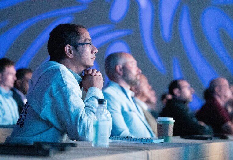 global summit audience watching key notes