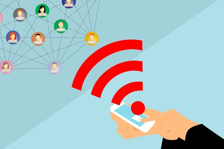 hands holding a mobile phone while a finger taps the screen to show a wi-fi signal and a network of contacts