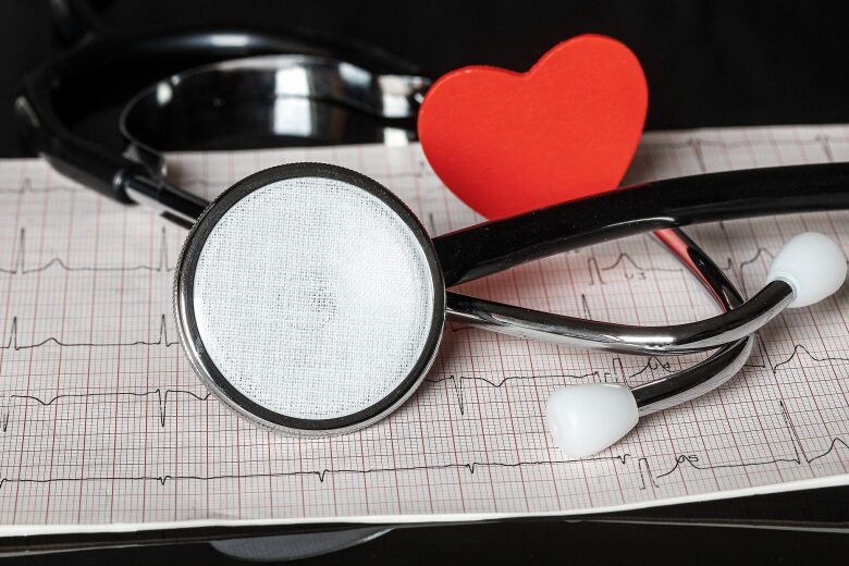 stethoscope and red heart on a print out from heart rate monitor