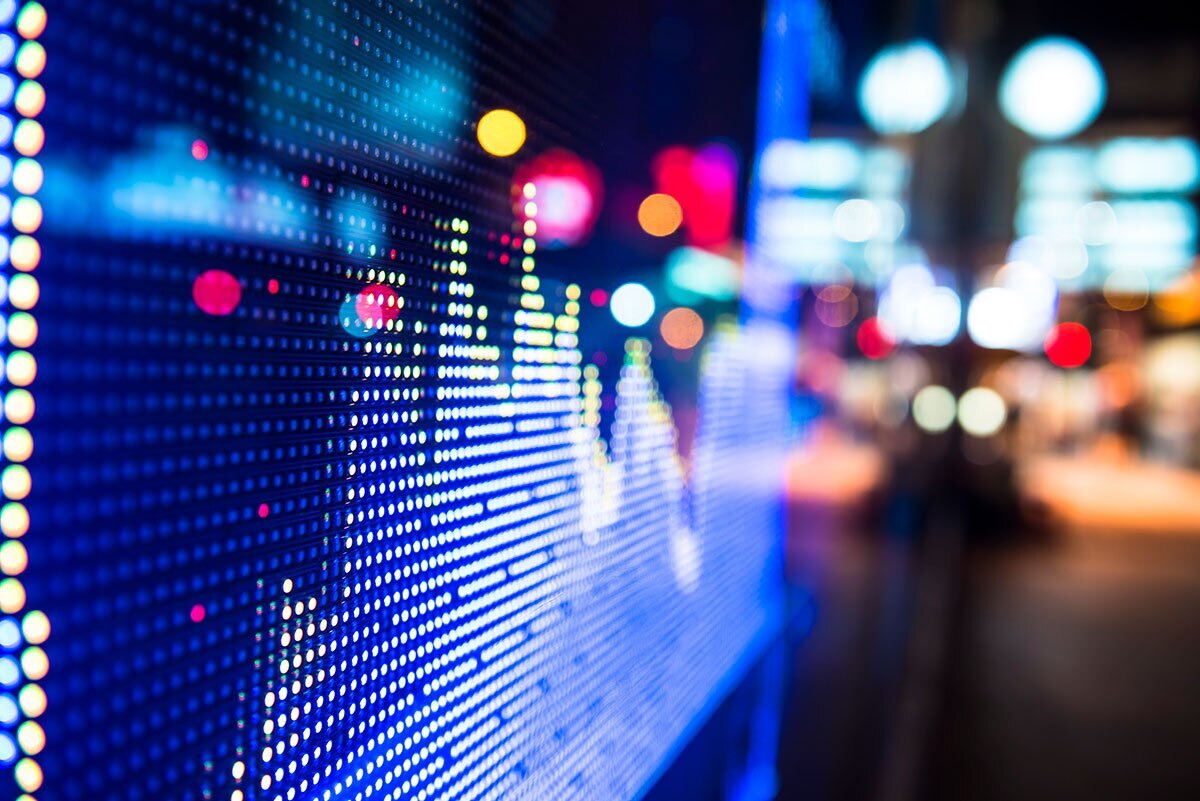 bright lights of a screen showing data in a graph