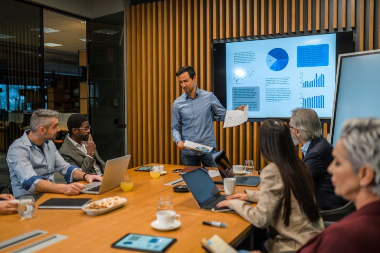Businessman Updating Board Members