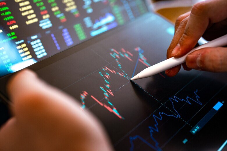 financial graphs on tablet