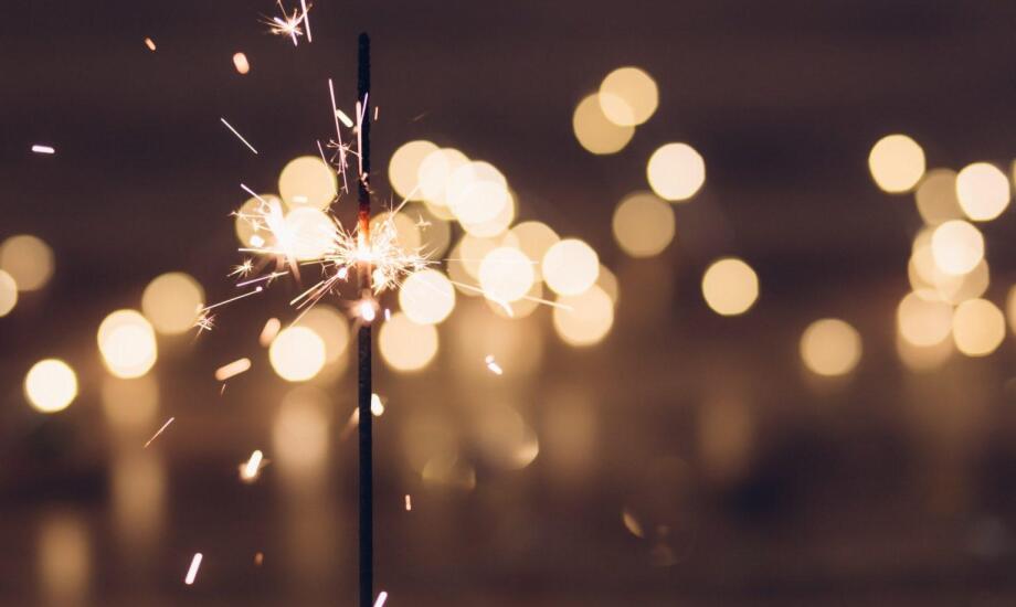 sparkler sparking in front of blurred background