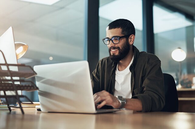 man working at laptop