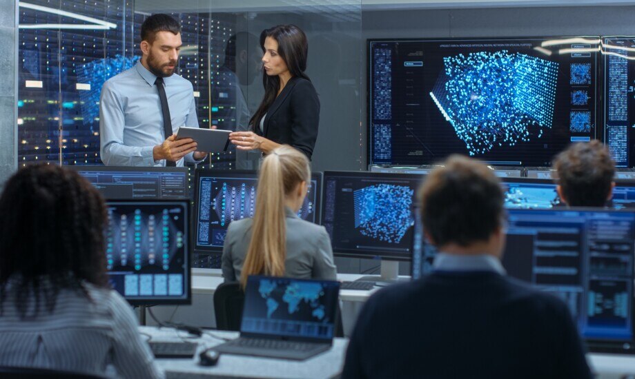 group of colleagues analyzing data in real-time