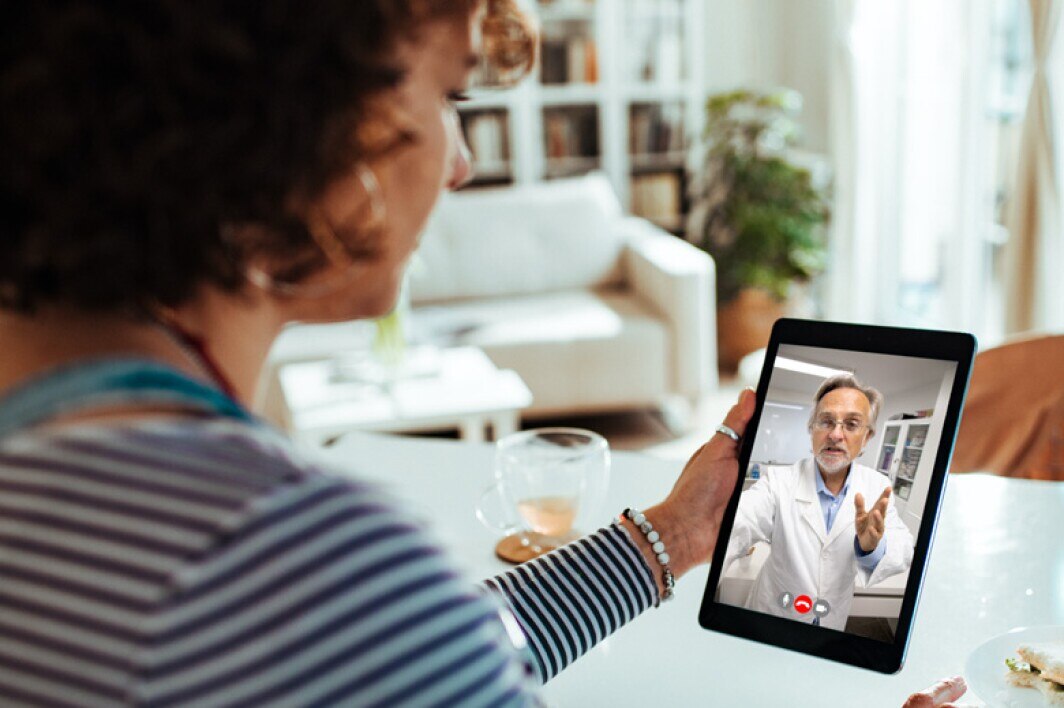 patient using tablet for a virtual doctor visit