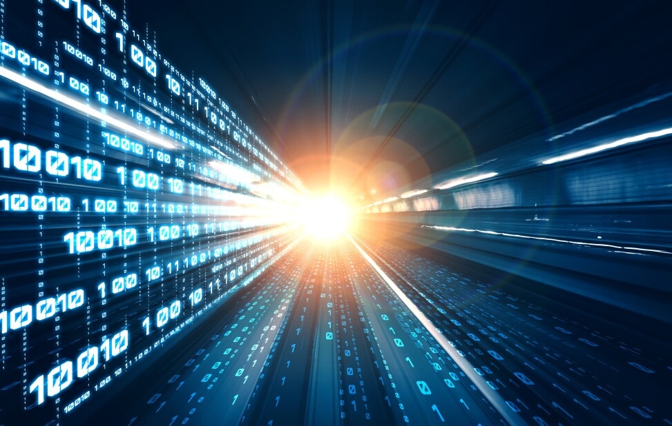 binary number sequences line a subway tunnel as the single headlight of a train shines bright